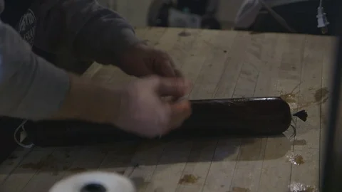 Cook making sausage links Stock Footage 104867308