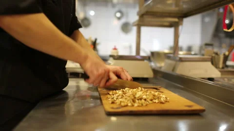 Cook man, chopped walnuts Stock Footage 48643172