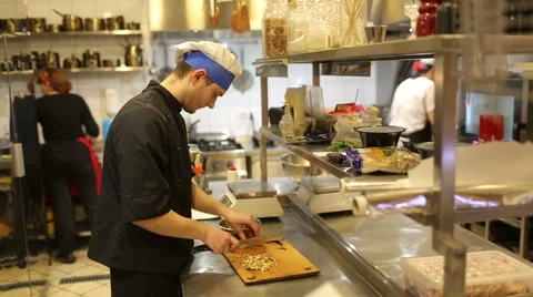 Cook man, chopped walnuts Stock Footage 48644348