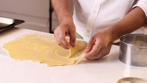 Cook man handling dough for making quiche Stock Footage 153771690
