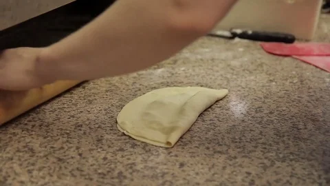 Cook man prepares cheburek, glues borders of dough inside. Stock Footage 79334418