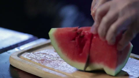 Cook masterfully slices watermelon Stock Footage 96984796