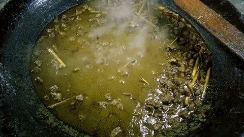 Cook meat in a large pan 1. Full HD Stock Footage 92235865