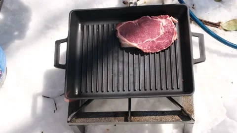 Cook meat on snow Stock Footage 181235152