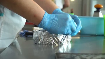 Cook molds a foil for baking a cake Stock Footage 85661720