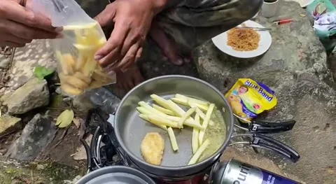 Cook noodles in the jungle Stock Footage 238625916