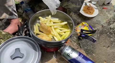 Cook noodles at sendang waterfall Stock Footage 239598041