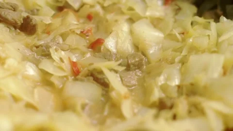 The cook opens the lid of the pot and checks the cooking Stock Footage 249697421