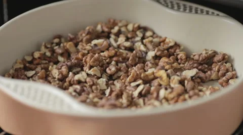 Cook in the oven for roasting nuts Stock Footage 53321607