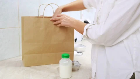 Cook pack delivery order in restaurant kitchen Stock Footage 218404483