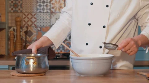 Cook  passing the composition through the sieve for dessert 스톡 동영상 87582861