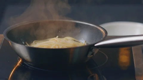 Cook pasta in the kitchen Stock Footage 129693456