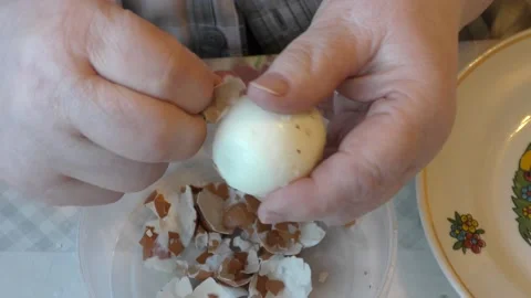The cook peels the egg from the shell Stock Footage 194141375