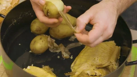 The cook peels the potatoes Stock Footage 145647558