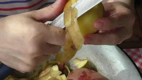 The cook peels the potatoes Video stock 154846932