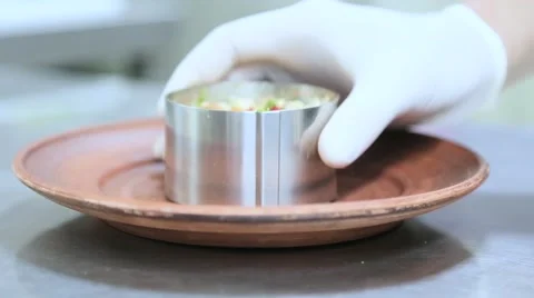 Cook picks up a form for salad Stock Footage 61926784