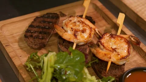 A cook places fried shrimp on bread. Slow motion. Stock Footage 303746489