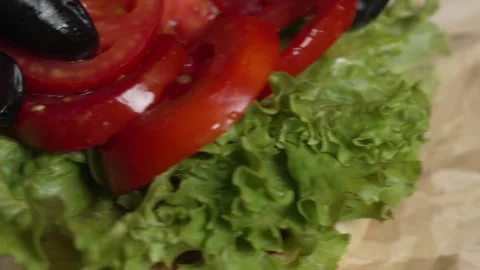 Cook placing sliced ​​tomatoes Stock Footage 297004234
