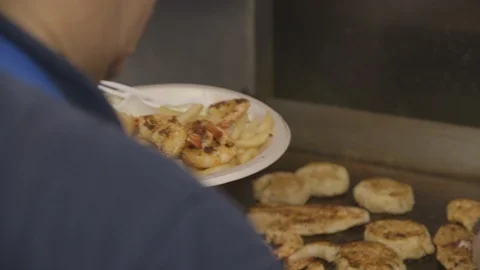 Cook plating seafood dish for restaurant Stock Footage 104881378