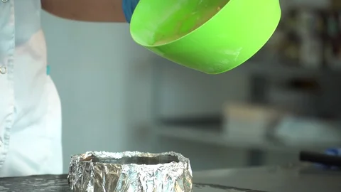 The cook pours the dough into the mold Stock Footage 85663850