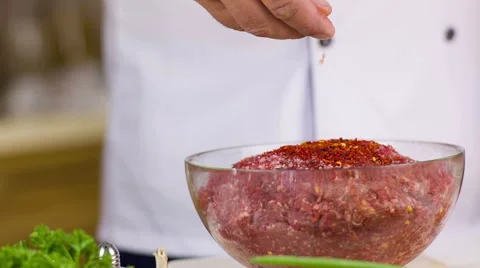 Cook pours spices Stock Footage 49383423