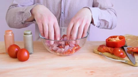 The cook prepares and marinates the turkey for baking on a charcoal oven. Stock Footage 152074643