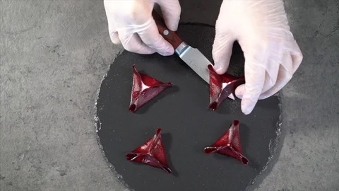 Cook prepares beetroot appetizer. A cook decorates a beetroot appetizer Stock Footage 126447239