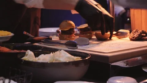 Cook prepares Burger in the restaurant Stock Footage 111952857