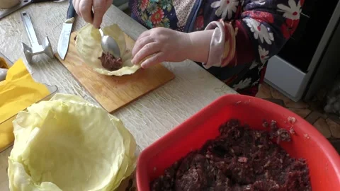 The cook prepares cabbage rolls with meat and cabbage. healthy food concept Stock Footage 149312987