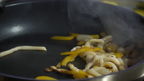 Cook prepares the dish in a boiling pan Stock Footage 148314753
