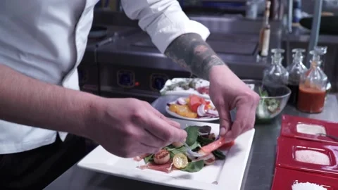 The cook prepares the dish Stock Footage 130500108