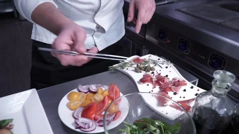 The cook prepares the dish Stock Footage 130500143