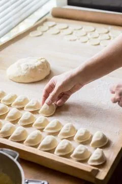 Cook prepares dumplings Stock Photos