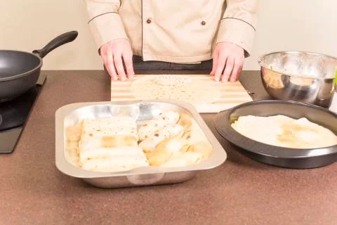 Cook prepares empanadas Stock Photos