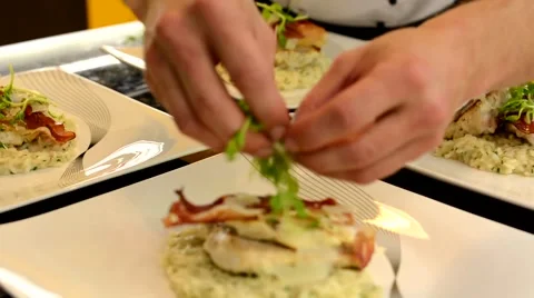 Cook prepares foods for serving Stock Footage 44164490