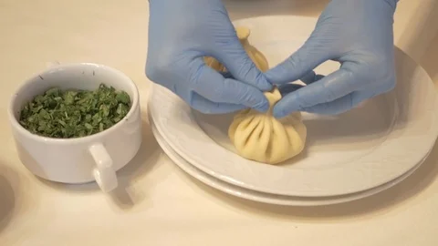 The cook prepares hinkali Stock Footage 87311883