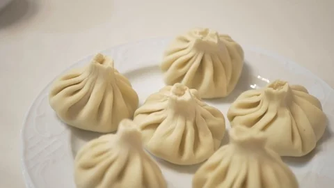 The cook prepares hinkali Stock Footage 87311892