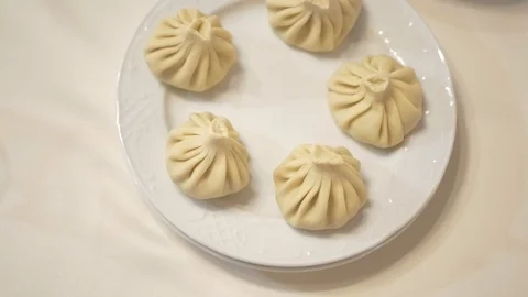 The cook prepares hinkali Stock Footage 87311897