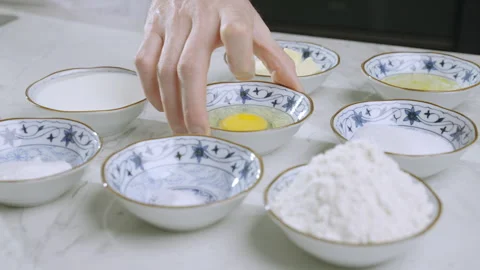 The cook prepares the ingredients for the pancake batter. Flour, baking powder. Stock Footage 269770010