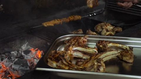 The cook prepares lamb meat on the grill Stock Footage 74306796