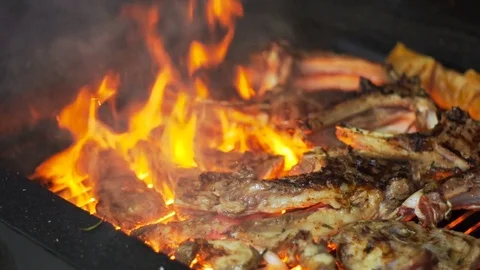 The cook prepares lamb meat on the grill, in slow motion Stock Footage 74306988