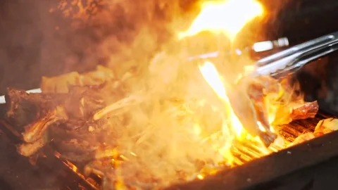 The cook prepares lamb meat on the grill Stock Footage 74307057