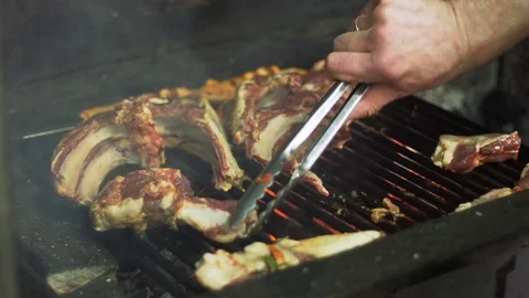 The cook prepares lamb meat on the grill Stock Footage 74307317