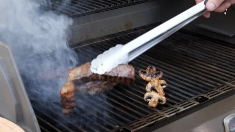 The cook prepares the meat on the grill Stock Footage 116769434