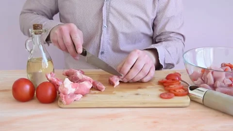 The cook prepares the meat for marinating. Stock Footage 152074632