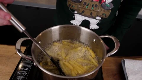 The cook prepares potato chips with salad and delicious sauce. 4K shooting Stock Footage 132729161