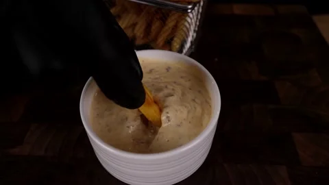The cook prepares potato chips with salad and delicious sauce. 4K shooting Stock Footage 132731136
