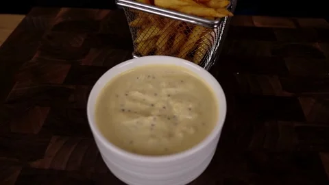 The cook prepares potato chips with salad and delicious sauce. 4K shooting Stock Footage 132731190