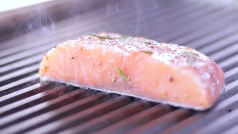 Cook prepares salmon on the grill Stock Footage 109471375