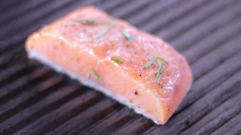Cook prepares salmon on the grill Stock Footage 109471381